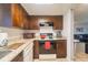 Modern kitchen features dark cabinets, granite countertops, and an open design at 7205 San Luis Ct, Tampa, FL 33634