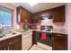 Bright kitchen features granite countertops, wood cabinets, and modern appliances at 7205 San Luis Ct, Tampa, FL 33634