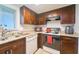 Efficient kitchen layout with dark cabinets, granite countertops, and modern amenities at 7205 San Luis Ct, Tampa, FL 33634