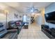 Comfortable living room with tile floors, cozy seating, and a neutral color scheme at 7205 San Luis Ct, Tampa, FL 33634