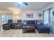 Relaxing living room area showcasing comfortable seating and stylish décor with natural lighting at 7205 San Luis Ct, Tampa, FL 33634