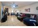 Spacious living room featuring tile floors, a ceiling fan, and an open floorplan at 7205 San Luis Ct, Tampa, FL 33634