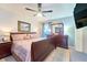 Spacious primary bedroom featuring a king bed, dresser, and a ceiling fan for added comfort at 7205 San Luis Ct, Tampa, FL 33634