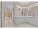 Bathroom features a large vanity, tile floor, and a view into an adjacent room at 731 Waterside Ct, Tarpon Springs, FL 34689
