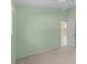 Bedroom with a high ceiling and door into another room at 731 Waterside Ct, Tarpon Springs, FL 34689