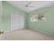Bedroom with high ceilings, carpet, and closet at 731 Waterside Ct, Tarpon Springs, FL 34689