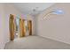 Bright and airy bedroom featuring neutral carpeting, access to the pool area, and a large window at 731 Waterside Ct, Tarpon Springs, FL 34689