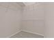 Neutral walk-in closet with carpet and white wire shelving at 731 Waterside Ct, Tarpon Springs, FL 34689