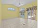 Living space with tiled floors, large windows, and access to the pool at 731 Waterside Ct, Tarpon Springs, FL 34689
