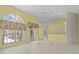 Bright and airy living space with tile flooring and access to multiple rooms at 731 Waterside Ct, Tarpon Springs, FL 34689
