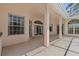 The large covered patio offers space for seating and entertaining with access to the backyard at 731 Waterside Ct, Tarpon Springs, FL 34689