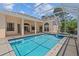 A private pool and spa offer relaxation and recreation in this backyard oasis at 731 Waterside Ct, Tarpon Springs, FL 34689