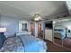 Bright bedroom featuring mirrored closet doors, a ceiling fan, and ensuite bathroom at 7910 Sun Island S Dr # 203, South Pasadena, FL 33707