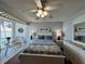 Serene bedroom with water view, featuring comfortable furnishings and a calming color scheme, perfect for relaxation at 7910 Sun Island S Dr # 203, South Pasadena, FL 33707