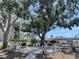 Outdoor common area featuring comfortable seating, shade trees, and well-maintained grounds for residents at 7910 Sun Island S Dr # 203, South Pasadena, FL 33707