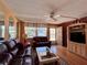 Cozy living room featuring comfortable sofas, a decorative rug, and ample natural light at 7910 Sun Island S Dr # 203, South Pasadena, FL 33707