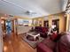 Inviting living room featuring plush seating, a decorative rug, and arched mirrors for added depth at 7910 Sun Island S Dr # 203, South Pasadena, FL 33707