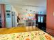 Bright dining area offering an open view of the kitchen and a stylish wooden table at 808 53Rd E Ave # 142K, Bradenton, FL 34203