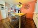 Stylish dining room featuring a wooden table, transparent chairs, and unique modern accents at 808 53Rd E Ave # 142K, Bradenton, FL 34203