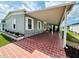 Inviting exterior featuring a large, covered brick patio at 808 53Rd E Ave # 142K, Bradenton, FL 34203