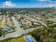An expansive aerial view showcasing a residential area with waterfront homes and direct ocean access at 8727 Bay Crest Ln, Tampa, FL 33615