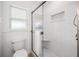 Updated bathroom featuring a glass shower with white subway tile and a built-in niche at 8727 Bay Crest Ln, Tampa, FL 33615