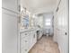 Bathroom with double sinks, modern lighting, and ample cabinet space at 8727 Bay Crest Ln, Tampa, FL 33615