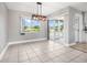 Bright dining room with pool views, modern lighting, and neutral walls at 8727 Bay Crest Ln, Tampa, FL 33615