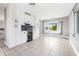 Open concept dining room showcasing updated cabinets and natural light at 8727 Bay Crest Ln, Tampa, FL 33615