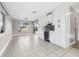 Open concept dining room showcasing updated cabinets and a beverage cooler at 8727 Bay Crest Ln, Tampa, FL 33615