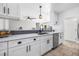 Beautiful, remodeled kitchen with white cabinets, stainless steel appliances, and tiled floors at 8727 Bay Crest Ln, Tampa, FL 33615