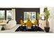 Open-concept dining room with yellow chairs, an adjacent living room, and a sleek modern design at 10296 Gentle Rain Dr, Land O Lakes, FL 34638