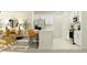 Open-concept living space featuring a living room, dining area, and a modern white kitchen at 10296 Gentle Rain Dr, Land O Lakes, FL 34638