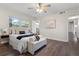A serene bedroom includes a queen-size bed, ceiling fan, and plenty of natural light at 1105 Oakview Ave, Clearwater, FL 33756