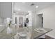 Bright kitchen boasts a granite countertop with white cabinets and stainless appliances at 1105 Oakview Ave, Clearwater, FL 33756