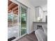 Bright kitchen with eat in bar connected to outside screened in porch at 1105 Oakview Ave, Clearwater, FL 33756