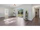 Sunlit open living space features wood-look floors and access to the backyard at 1105 Oakview Ave, Clearwater, FL 33756