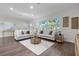 Open living room featuring hardwood floors, modern decor, and recessed lighting at 1105 Oakview Ave, Clearwater, FL 33756