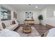 Beautifully staged living room with modern decor, hardwood floors, and lots of natural light at 1105 Oakview Ave, Clearwater, FL 33756