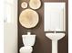 Cozy bathroom features a pedestal sink, modern fixtures, and stylish wall decor at 11111 E 65Th Ter, Palmetto, FL 34221