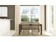 Bright dining area with stylish wicker chairs and a large window at 11111 E 65Th Ter, Palmetto, FL 34221