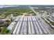 Aerial view showcasing the community's layout, parking areas, nearby roads and surrounding foliage and landscape at 12400 Park Blvd # 111, Seminole, FL 33772
