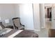 Bedroom with a comfortable chair and view into the kitchen at 12400 Park Blvd # 111, Seminole, FL 33772