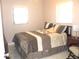 Bedroom with bed, pillows, and side table with lamp at 12400 Park Blvd # 111, Seminole, FL 33772