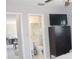 Bedroom with a television on top of a dresser with drawers next to the bathroom at 12400 Park Blvd # 111, Seminole, FL 33772