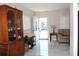 Welcoming entryway with marble floors, stylish cabinet, and a sunlit front door at 12400 Park Blvd # 111, Seminole, FL 33772