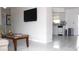 Open living room flows into kitchen, highlighting marble floors and stainless steel appliances at 12400 Park Blvd # 111, Seminole, FL 33772
