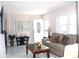 Bright living room features marble flooring, modern décor, and a large window at 12400 Park Blvd # 111, Seminole, FL 33772