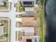 Drone shot of a residential street showing house roof, landscape, and pond at 12531 Midpointe Dr, Riverview, FL 33578