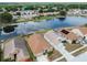 Aerial shot of a residential community with a large pond and well-maintained homes at 12531 Midpointe Dr, Riverview, FL 33578